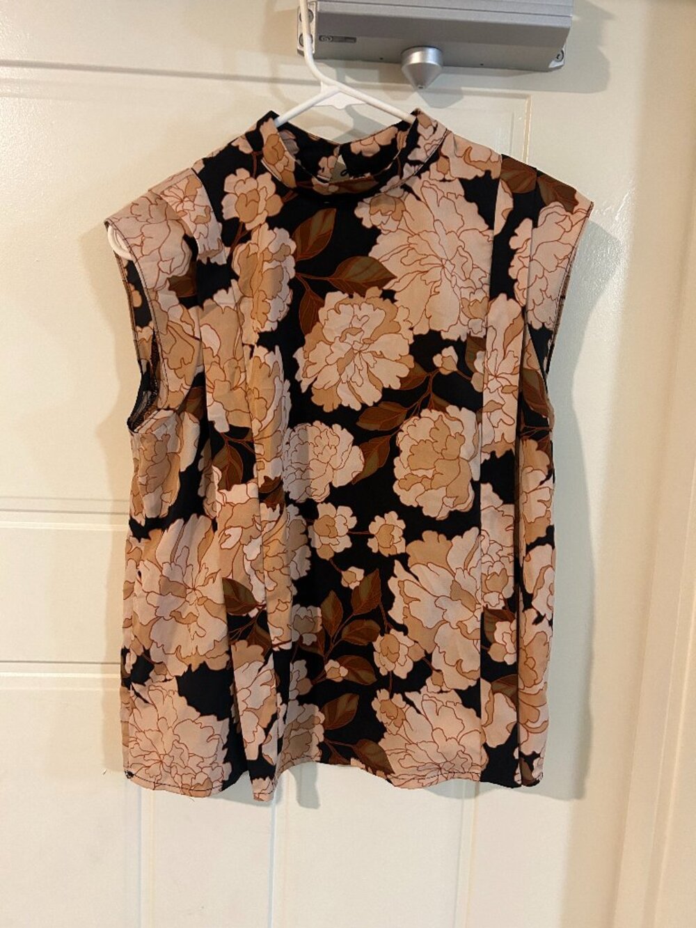 Sleeveless Floral Blouse with Mock Neckline